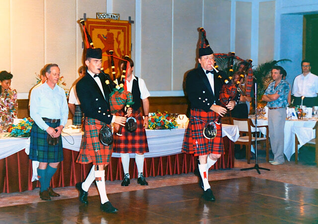 Colin playing the highland bagpipes at a Scottish event